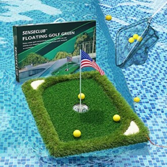Floating golf green in pool with golf balls and net.