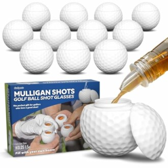 Golf ball-shaped shot glasses with packaging and liquid being poured.