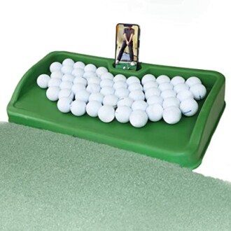 Golf ball tray with a phone holder and multiple golf balls.