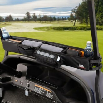 Golf cart organizer with drinks and accessories on a golf course.