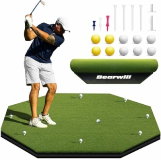 Man practicing golf swing on green mat with accessories.