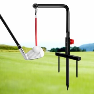 Golf swing training aid with club and ball on a grassy field.