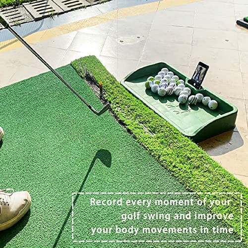 Golf swing training setup with mat, club, and balls.
