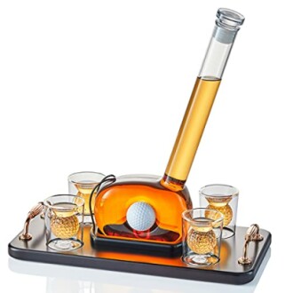 Golf-themed whiskey decanter set with glasses and golf ball design.