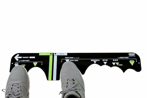 Golf alignment tool with feet for stance guidance
