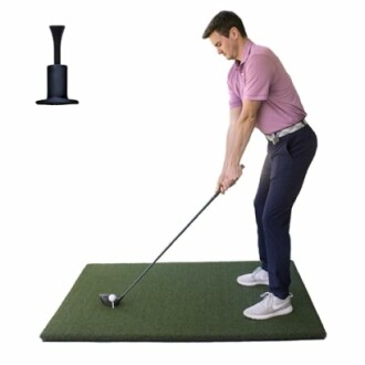 Man practicing golf swing on a green mat with a golf tee.