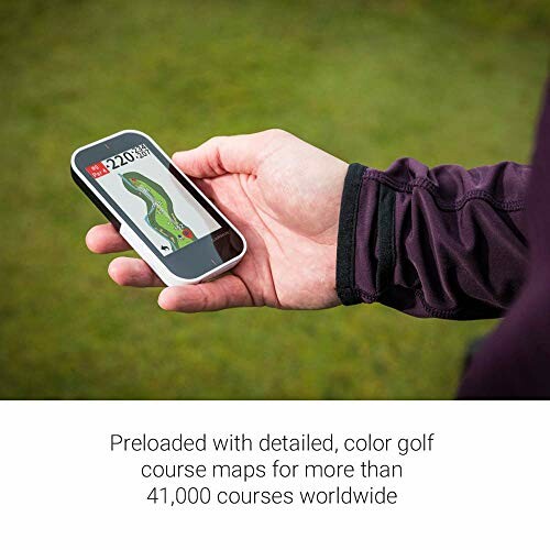 Person holding a golf GPS device with course map display.