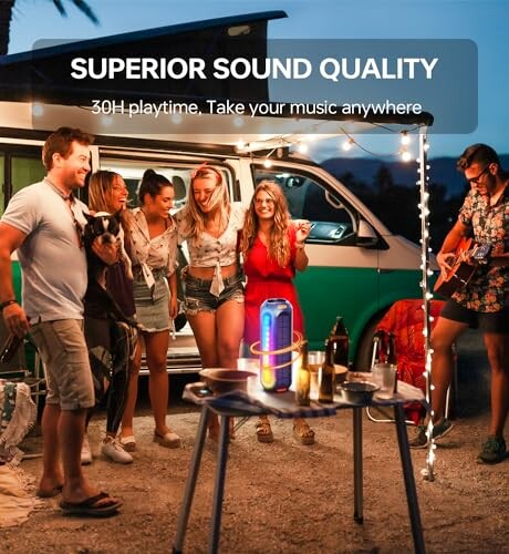 Group enjoying music by a van with a Bluetooth speaker.