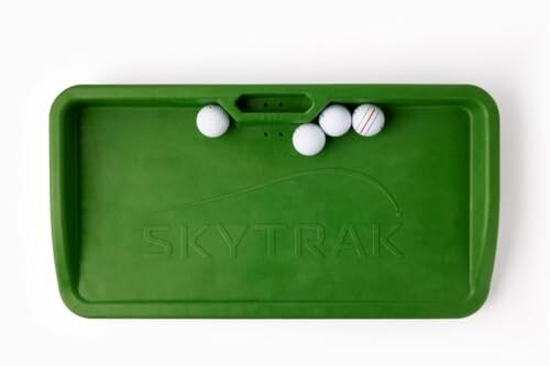 Green SkyTrak golf ball tray with golf balls.